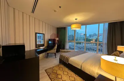 Room / Bedroom image for: Apartment - 1 Bathroom for rent in Emirates Tower - Hamdan Street - Abu Dhabi, Image 1