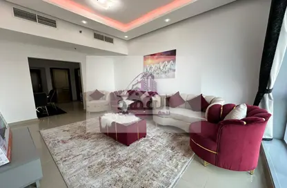Living Room image for: Apartment - 1 Bedroom - 2 Bathrooms for rent in Ajman Corniche Residences - Ajman Corniche Road - Ajman, Image 1