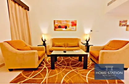 Living Room image for: Apartment - 1 Bedroom - 2 Bathrooms for rent in Ivory Grand Hotel Apartments - Al Barsha 1 - Al Barsha - Dubai, Image 1