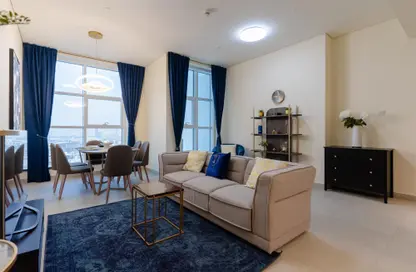 Living / Dining Room image for: Apartment - 2 Bedrooms - 2 Bathrooms for rent in Marina Arcade Tower - Dubai Marina - Dubai, Image 1