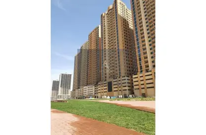Outdoor Building image for: Apartment - 2 Bedrooms - 2 Bathrooms for sale in Paradise Lakes Tower B5 - Paradise Lakes Towers - Emirates City - Ajman, Image 1
