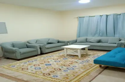 Living Room image for: Apartment - 1 Bedroom - 1 Bathroom for rent in Corniche Tower - Ajman Corniche Road - Ajman, Image 1