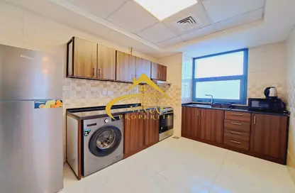 Kitchen image for: Apartment - 2 Bedrooms - 3 Bathrooms for rent in Sydney Tower - Jumeirah Village Circle - Dubai, Image 1