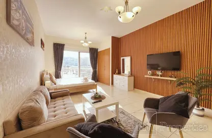 Living Room image for: Apartment - 1 Bathroom for sale in Gardenia 1 - Emirates Gardens 1 - Jumeirah Village Circle - Dubai, Image 1