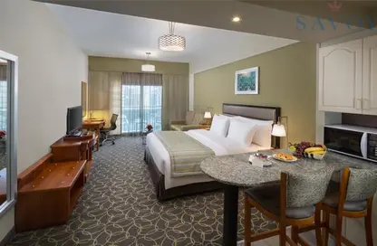 صورة لـ غرفة- غرفة النوم النزل و الشقق الفندقية - 1 حمام للايجار في منخول - بر دبي - دبي ، صورة رقم 1
