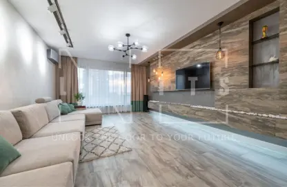 Living Room image for: Apartment - 1 Bedroom - 2 Bathrooms for sale in Verdana - Dubai Investment Park (DIP) - Dubai, Image 1