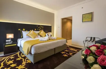 صورة لـ غرفة- غرفة النوم النزل و الشقق الفندقية - غرفة نوم - 2 حمامات للايجار في البرشاء 1 - البرشاء - دبي ، صورة رقم 1