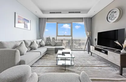 Living Room image for: Apartment - 2 Bedrooms - 2 Bathrooms for rent in Paramount Tower Hotel  and  Residences - Business Bay - Dubai, Image 1