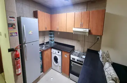 Kitchen image for: Apartment - 1 Bathroom for rent in Al Naemiya Towers - Al Nuaimiya - Ajman, Image 1