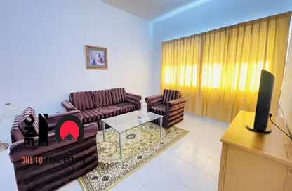 Living Room image for: Apartment - 2 Bedrooms - 2 Bathrooms for rent in Hamdan Street - Abu Dhabi, Image 1