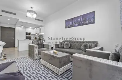 Living Room image for: Apartment - 1 Bedroom - 2 Bathrooms for rent in Lucky 1 Residence - Jumeirah Village Circle - Dubai, Image 1