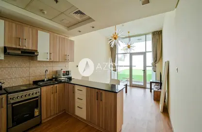 Apartment - 1 Bedroom - 2 Bathrooms for sale in Chaimaa Premiere - Jumeirah Village Circle - Dubai