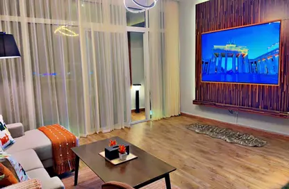 Living Room image for: Apartment - 2 Bedrooms - 3 Bathrooms for sale in Horizon Towers - Ajman Downtown - Ajman, Image 1