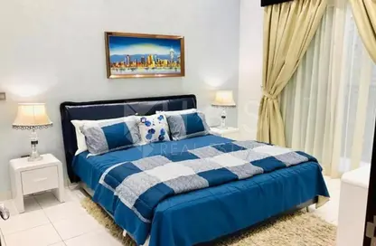 Room / Bedroom image for: Apartment - 1 Bedroom - 1 Bathroom for sale in Olivz Residence - International City - Dubai, Image 1