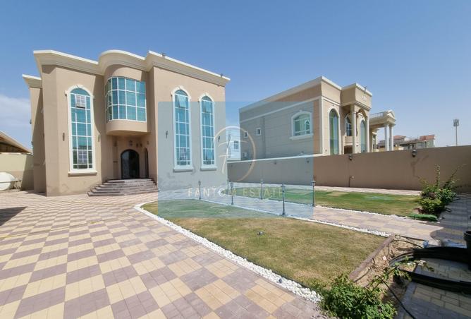 Rent in Al Khail Gate: Large 5BR | Garden | Maids room | Property Finder