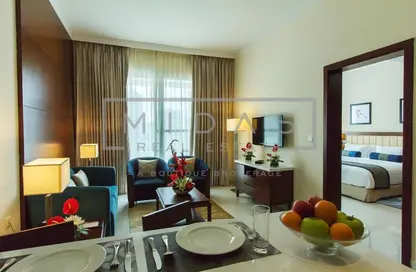 Living / Dining Room image for: Hotel  and  Hotel Apartment - 2 Bedrooms - 2 Bathrooms for rent in Treppan Hotel  and  Suites by Fakhruddin - Dubai Sports City - Dubai, Image 1